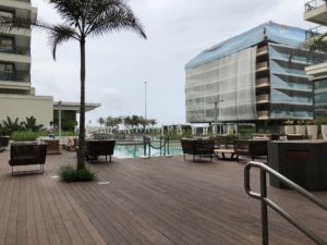 a pool with a building in the background