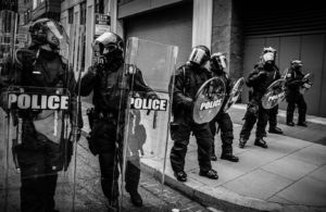 a group of police officers in riot gear