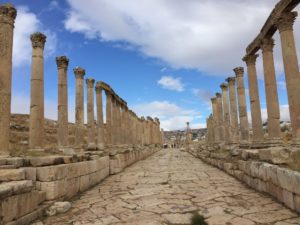 a stone walkway with pillars