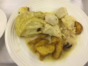 a plate of food on a white surface