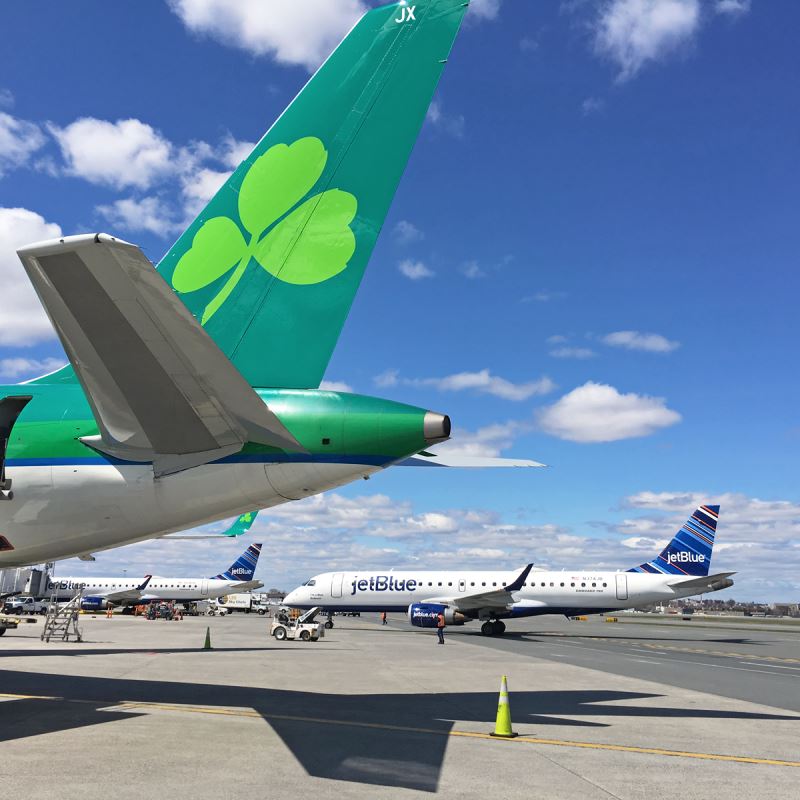 a group of airplanes on a runway