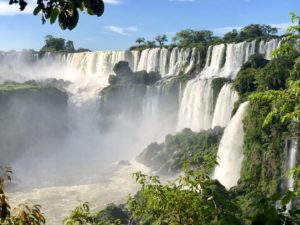Iguazu Falls with trees and blue sky