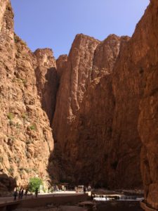 a man walking in a canyon