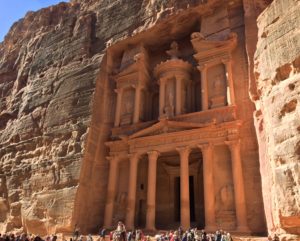 a group of people standing in front of Petra