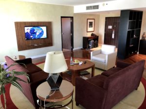 a living room with a television and couches