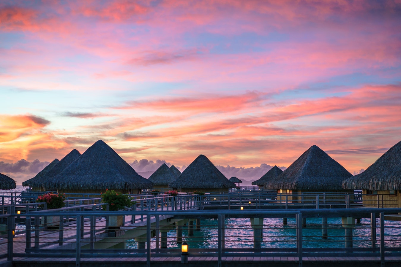 a group of huts on a dock