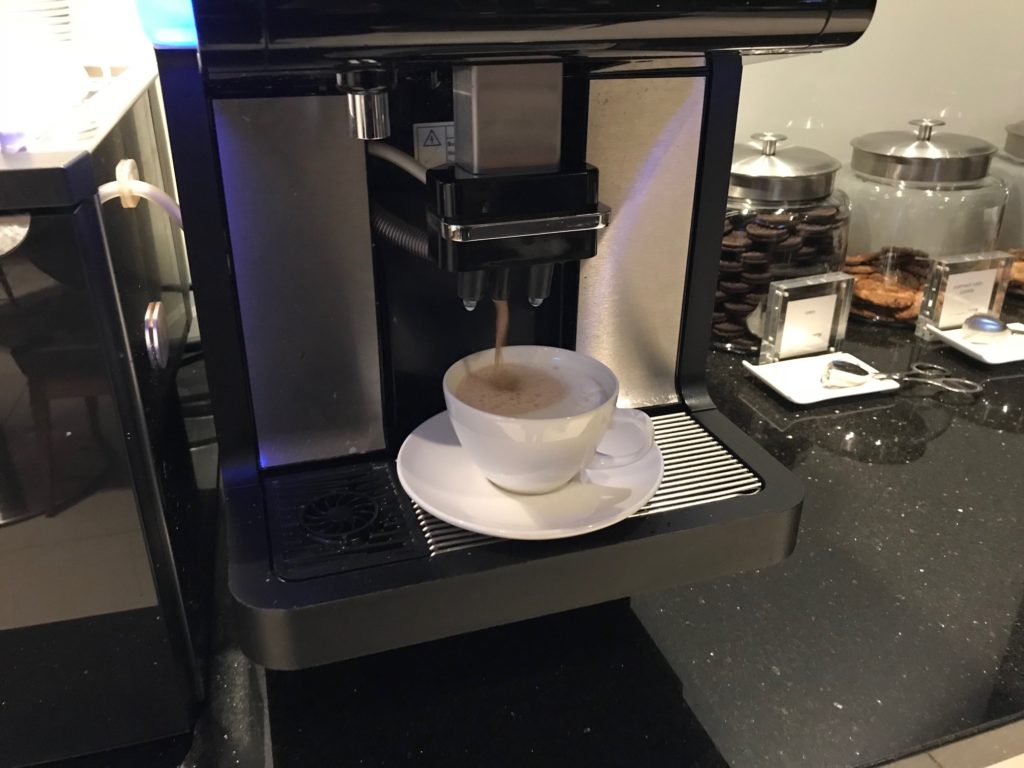 a coffee machine with a cup of coffee