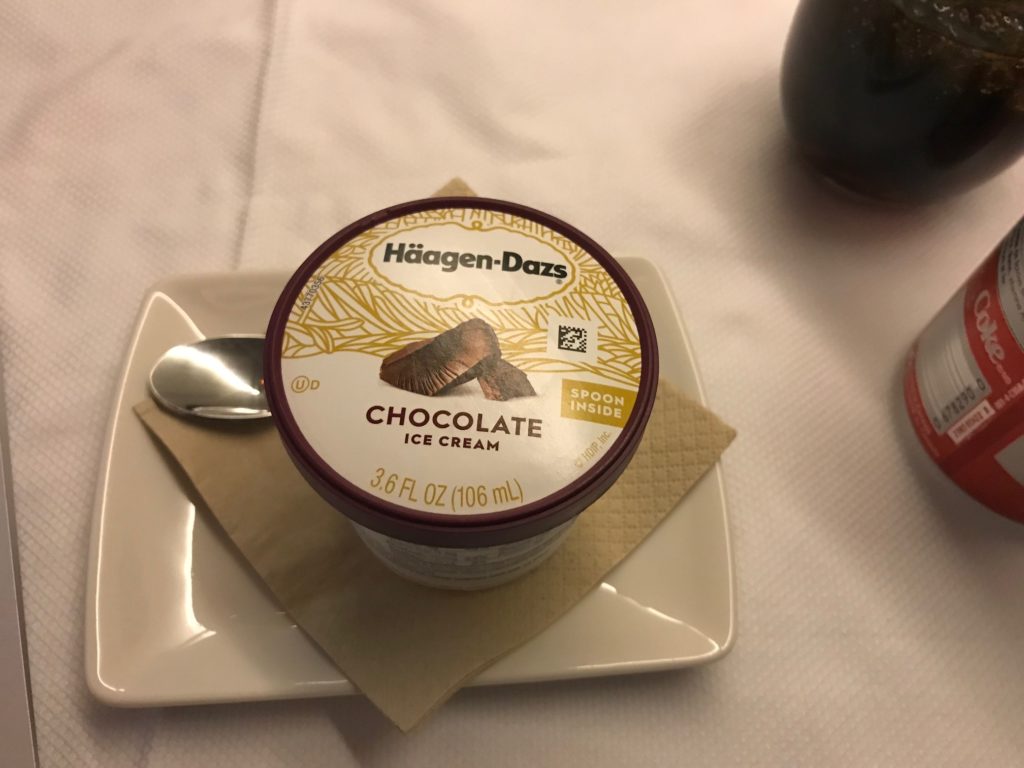 a container of ice cream on a plate