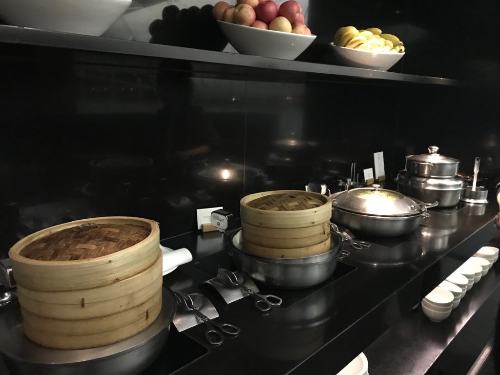 a group of bowls of food on a shelf