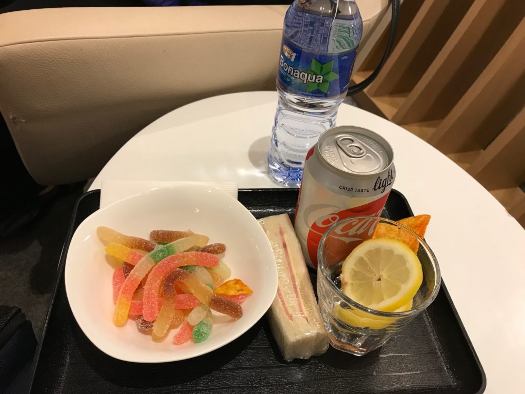 a tray with food and a bottle of water