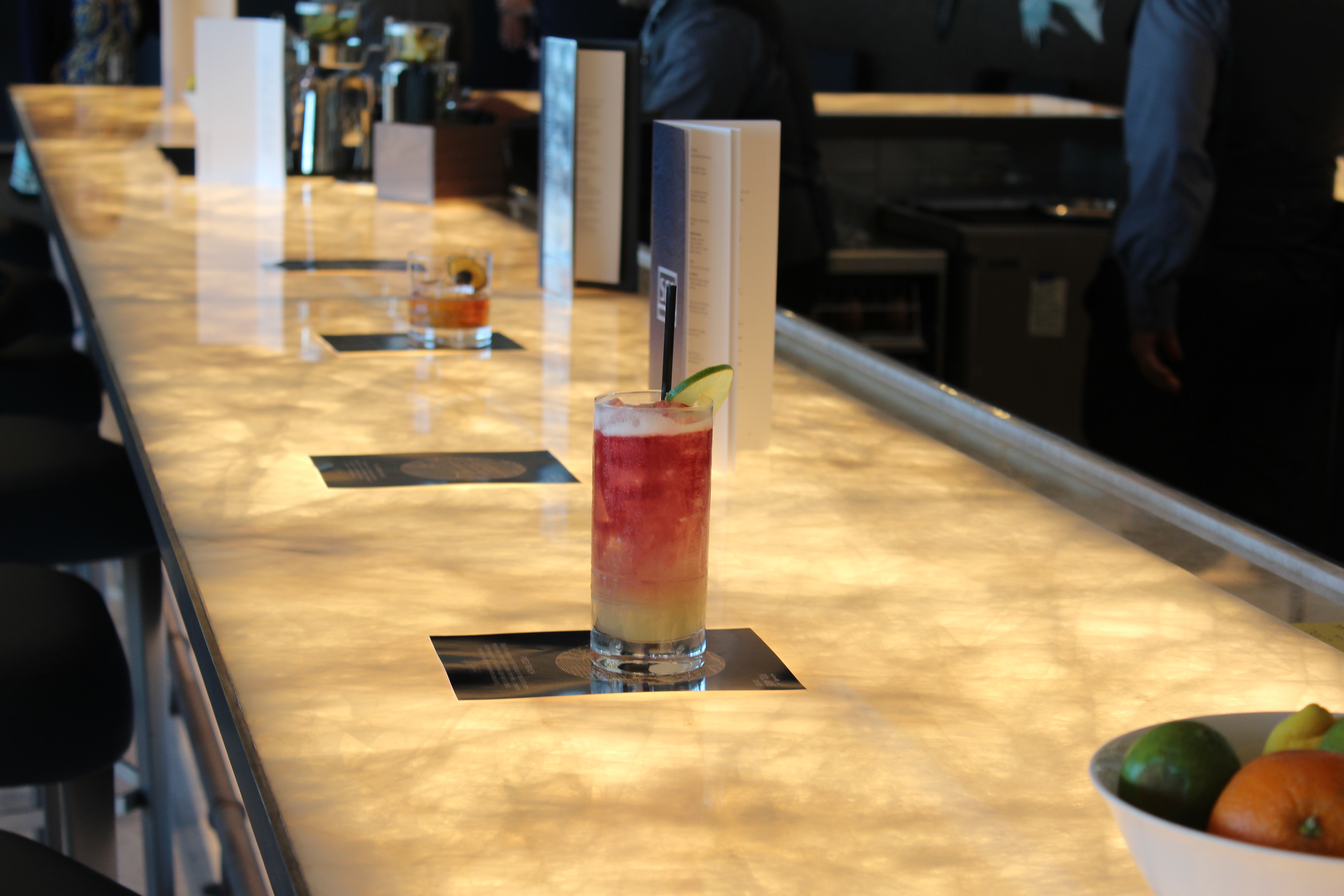 Drinks sit on the bar at the United Polaris Lounge San Francisco