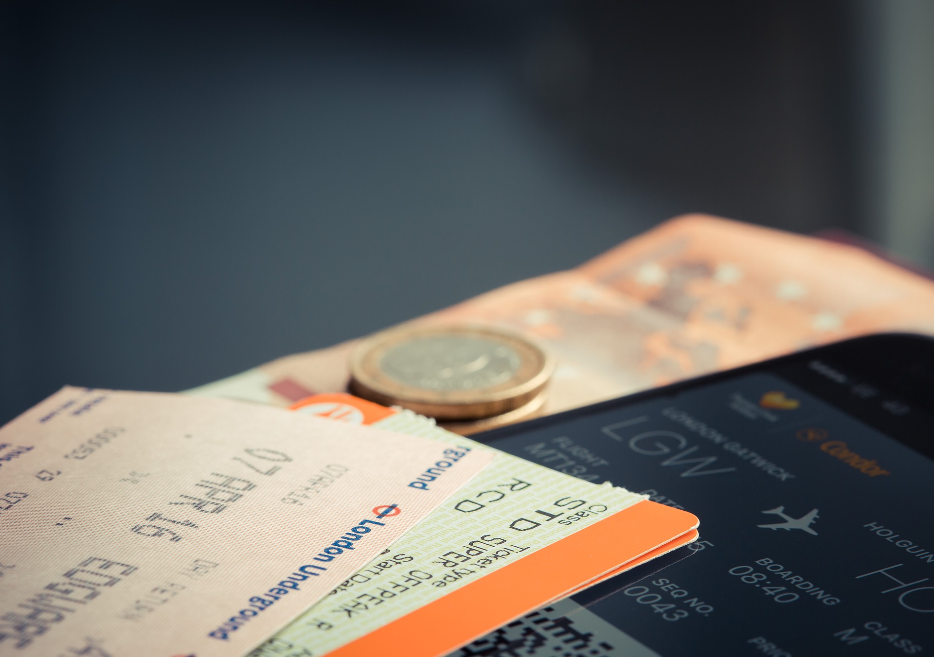 a close up of tickets and coins