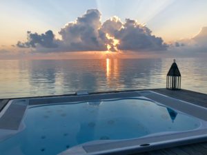 a hot tub overlooking the ocean