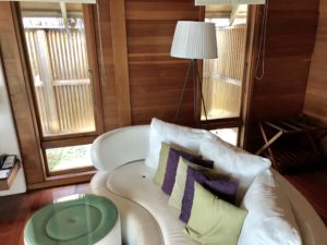 a white couch with pillows in a room