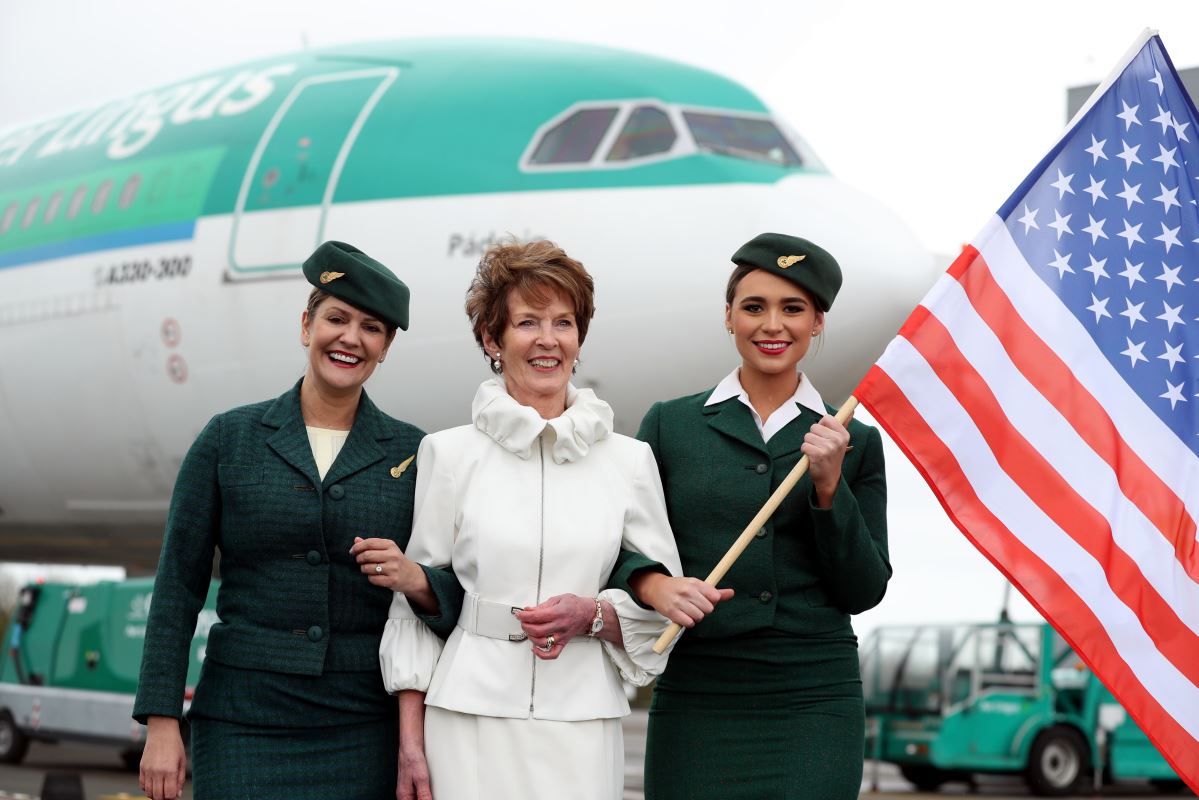 a group of women holding a flag