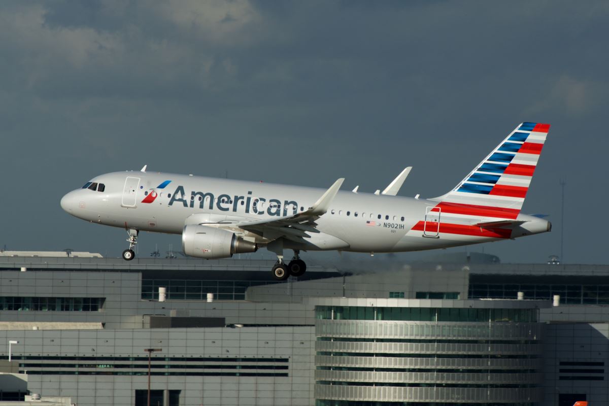 an airplane taking off from a building