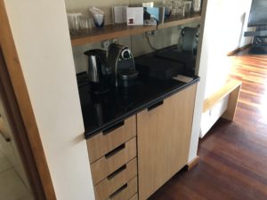 a kitchen counter with a black counter top