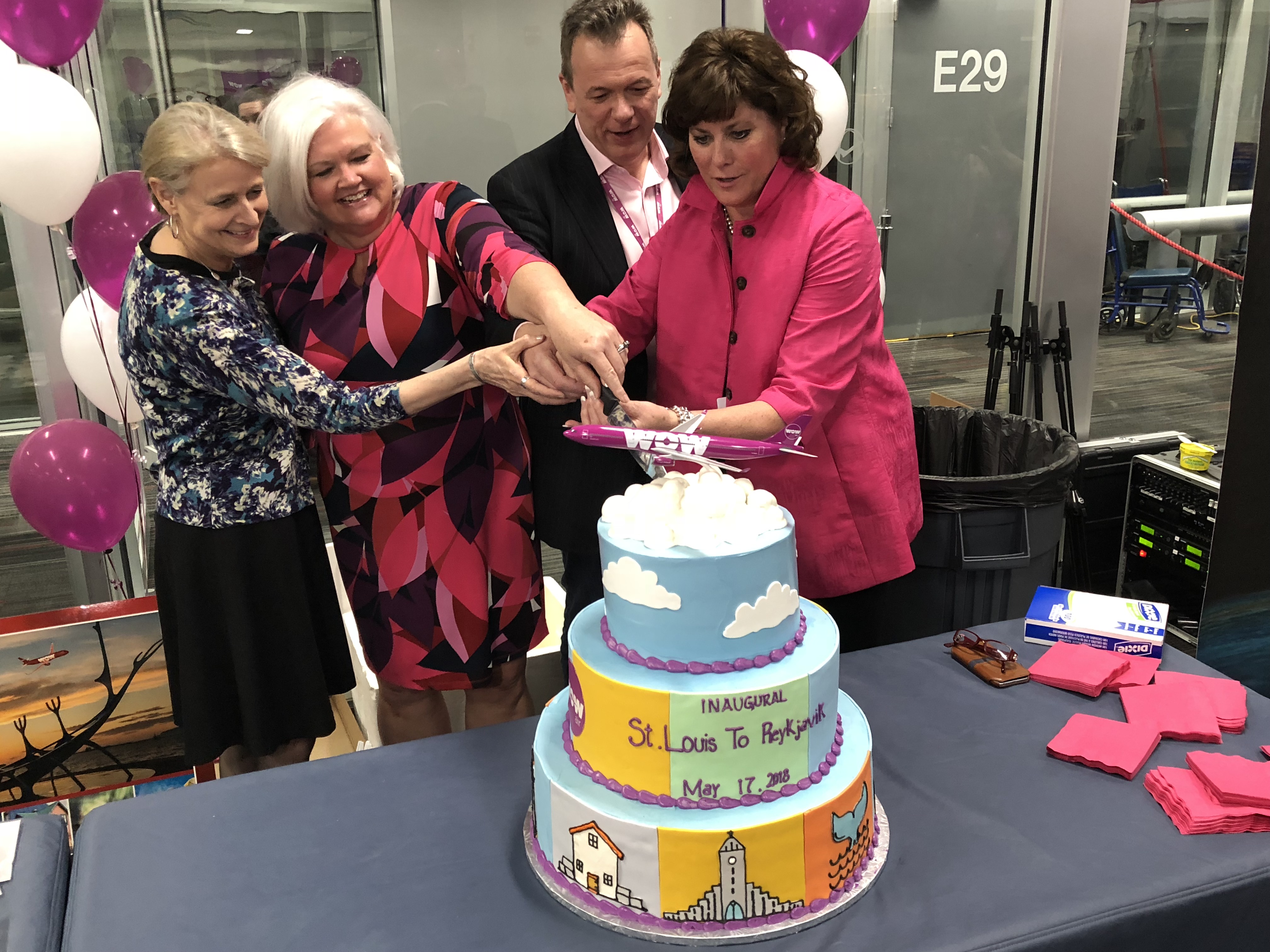 Airport Officials and Steve Tarbuck of WOWAir Cut a Piece of Ceremonial Cake