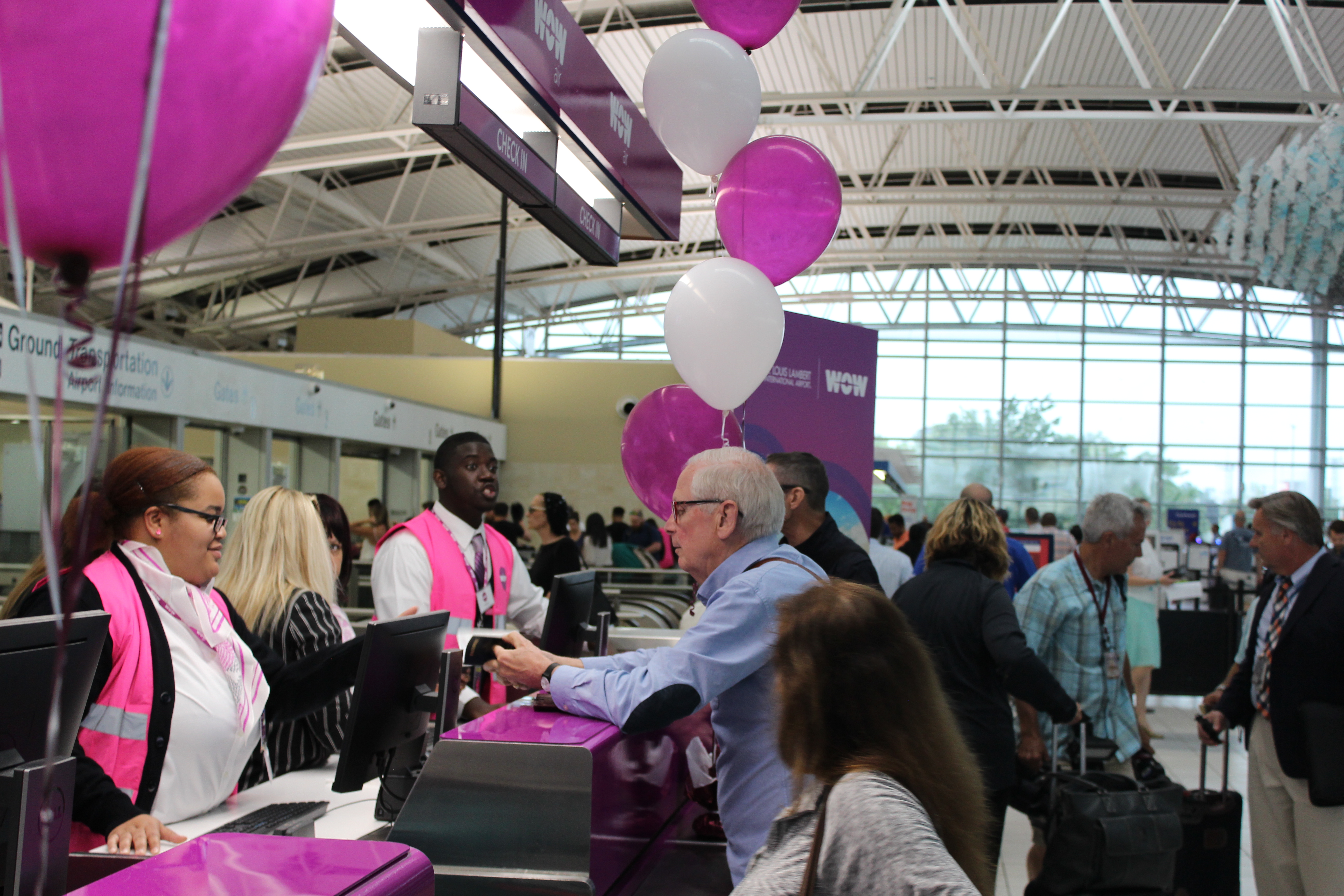 Passengers Talk to WOWAir Ticket Counter Employees