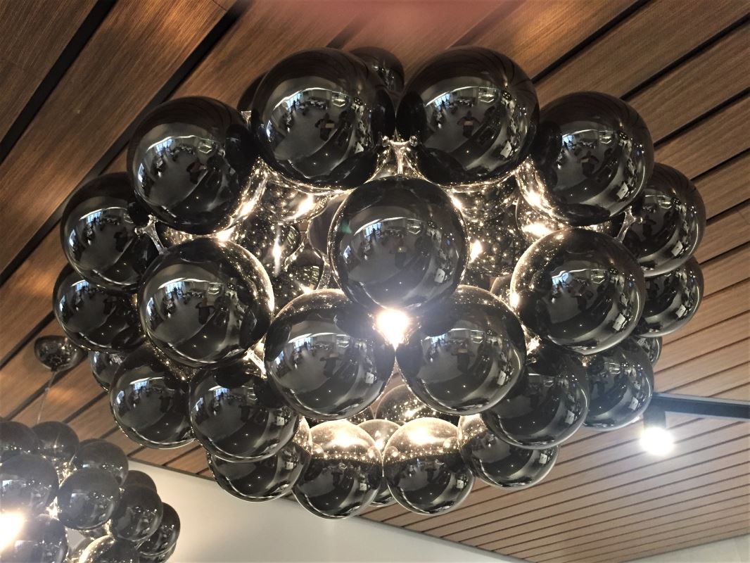 a chandelier with black balls