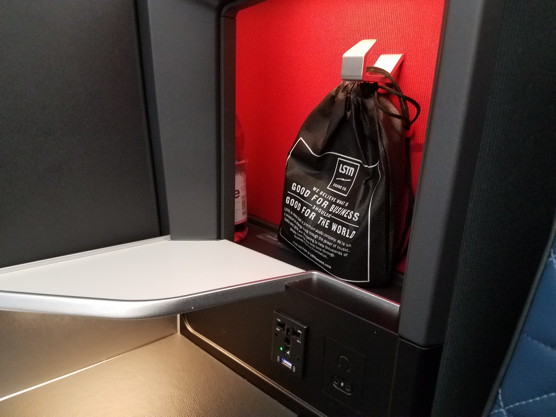 a black bag on a red surface