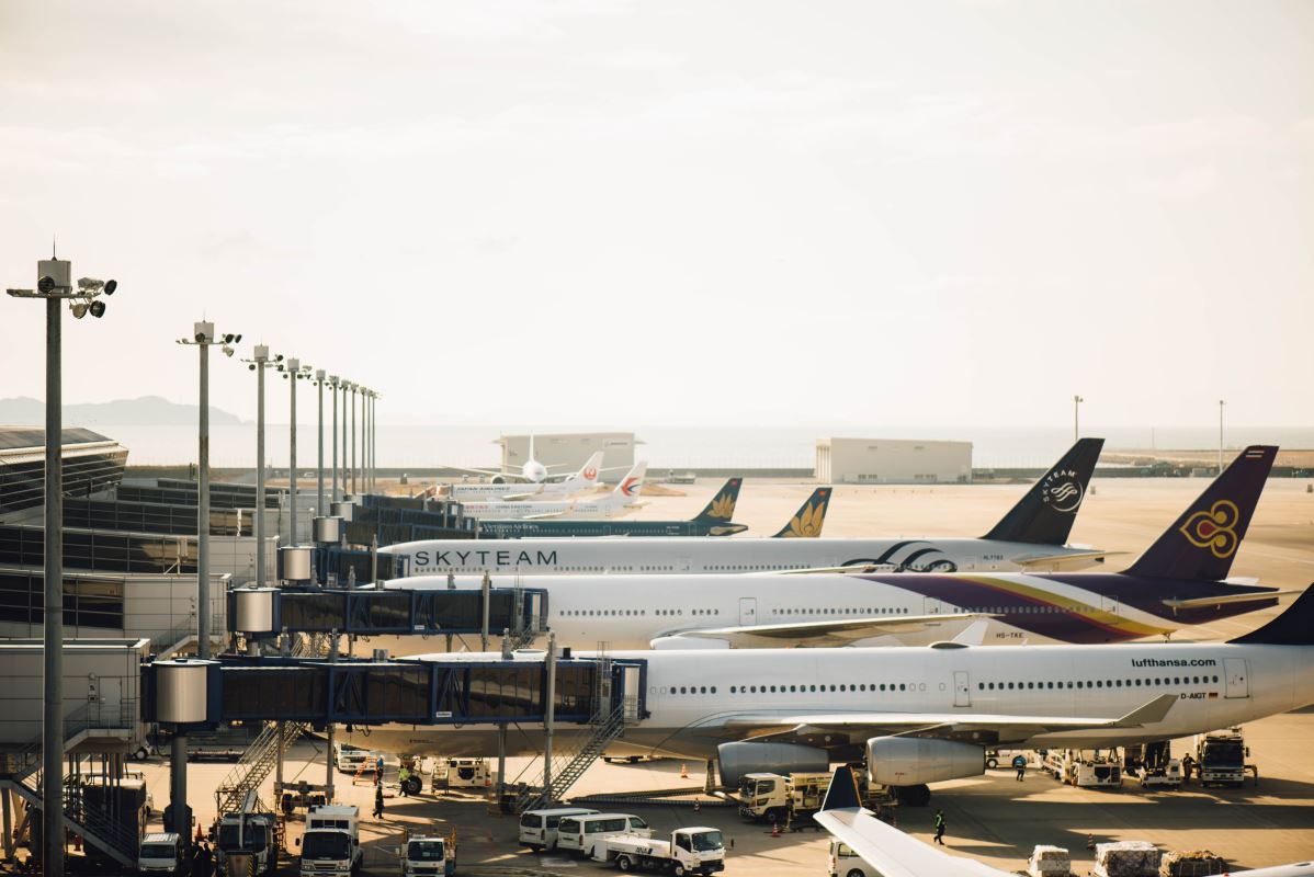 a group of airplanes at an airport