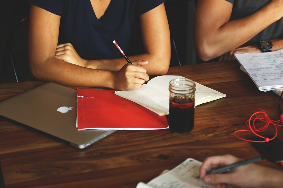 a group of people sitting at a table