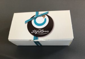 a white box with a blue ribbon