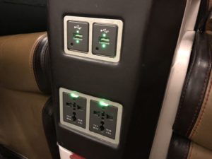 a power outlet with green lights