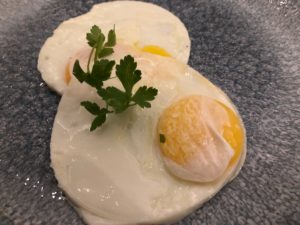 eggs on a plate with parsley
