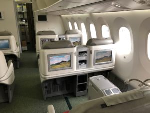 an airplane with seats and a bed