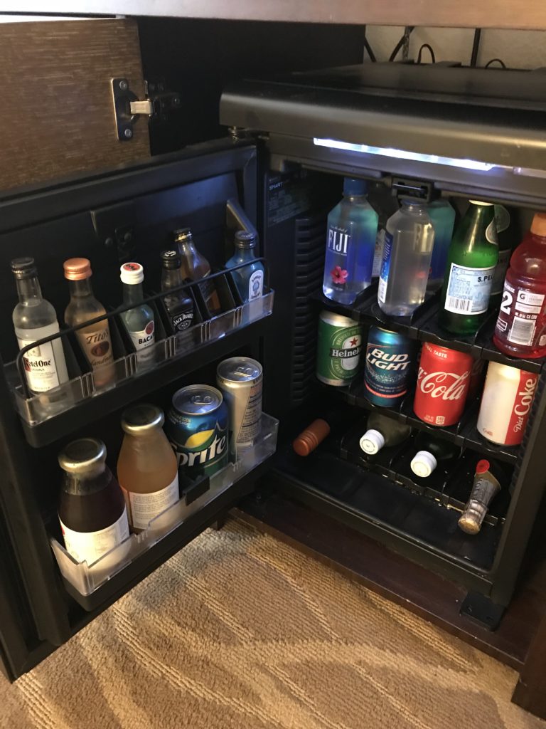 a mini fridge full of beverages