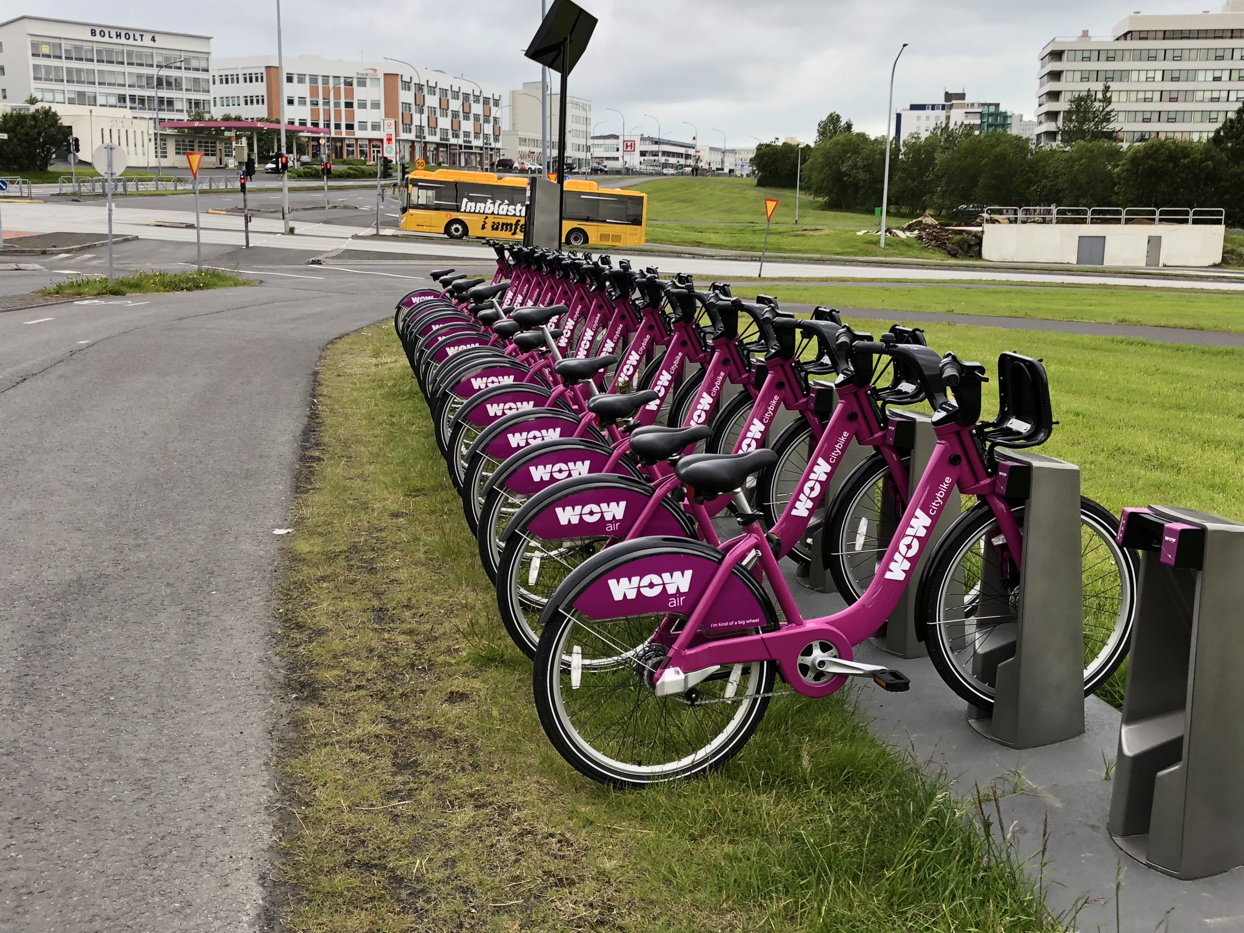 a row of purple bicycles