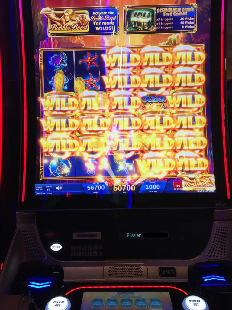 a slot machine with a lit screen