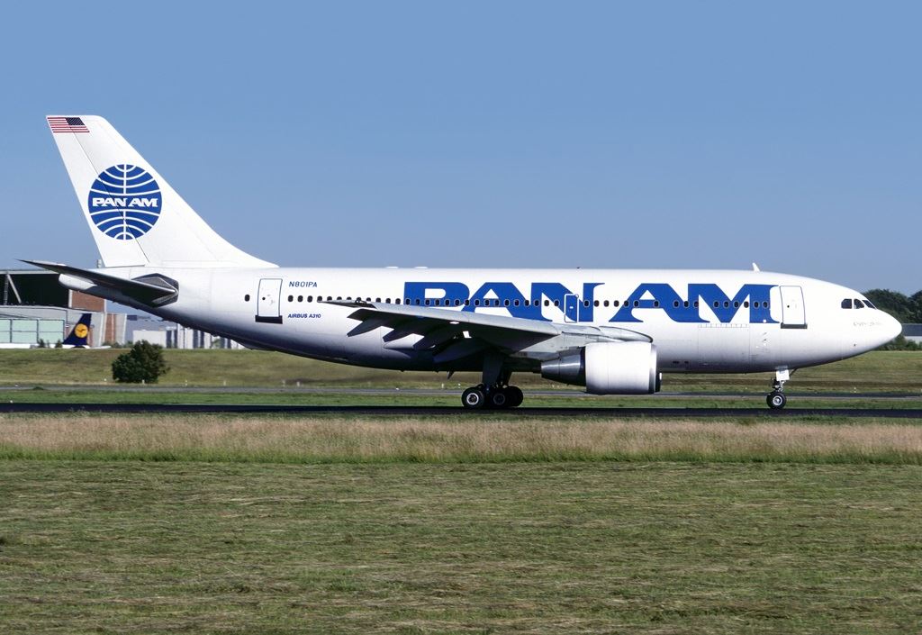 a large white airplane on a runway