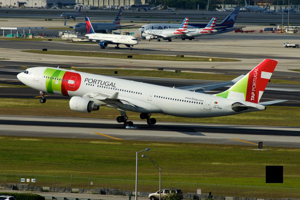 a group of airplanes on a runway