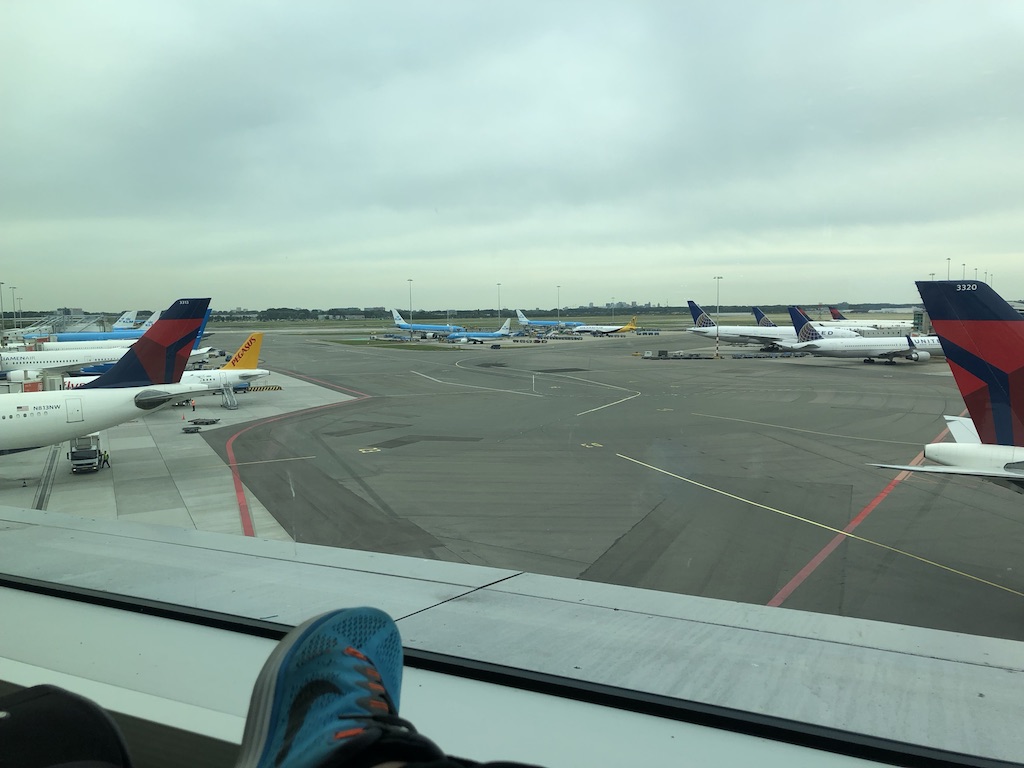 a group of airplanes on the runway