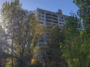 a building with trees in the background