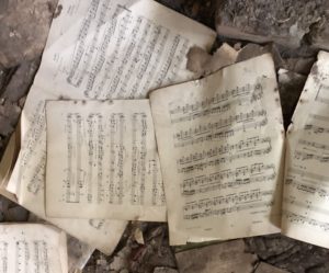 a group of music sheets on the ground