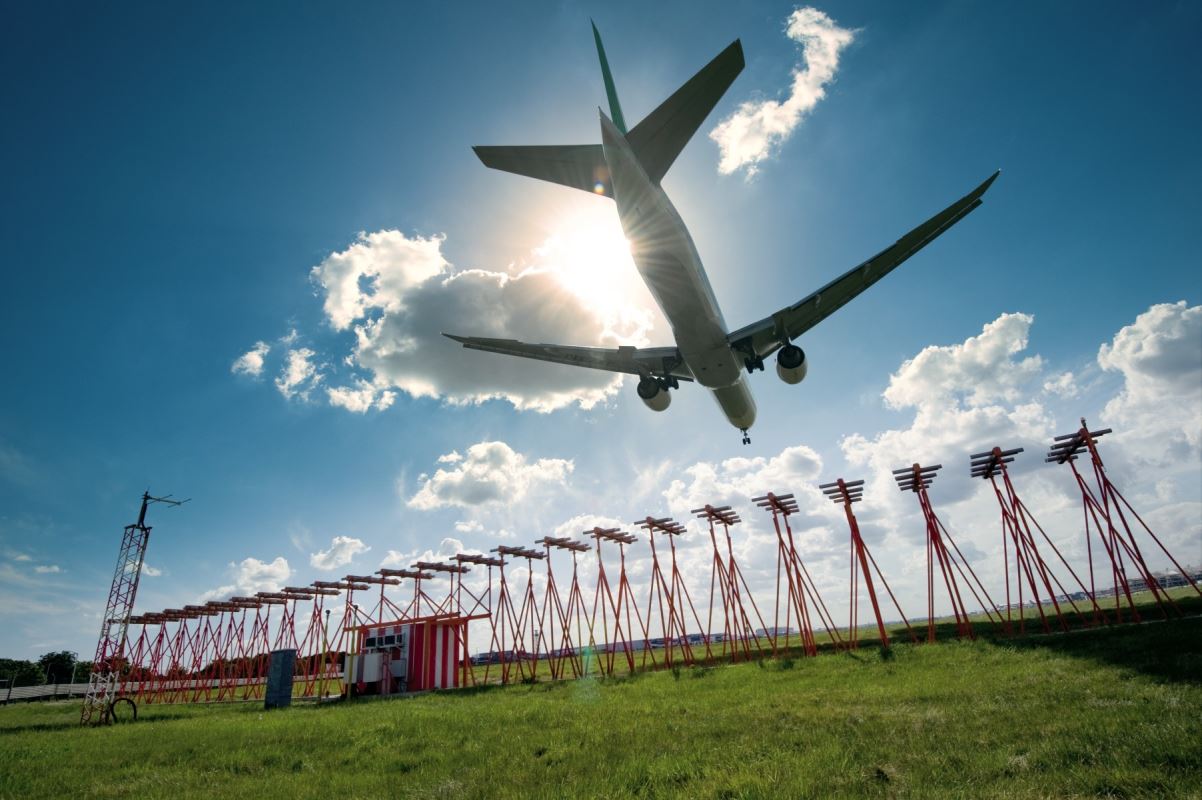 a plane flying over a field