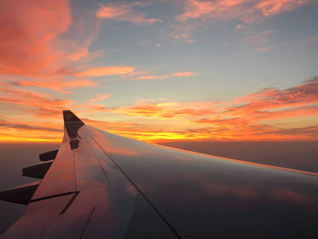 an airplane wing in the sky