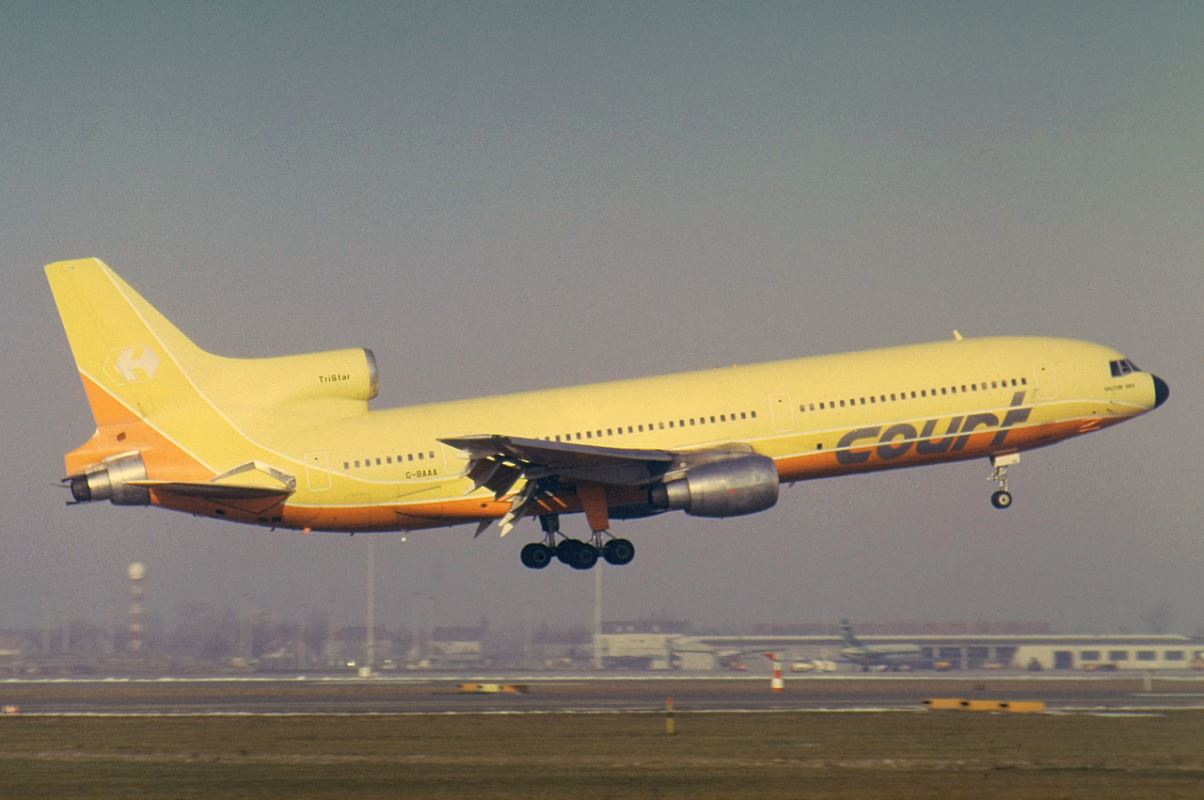 a yellow airplane taking off