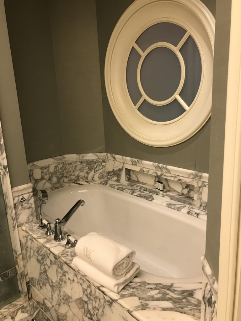 a bathtub with a round window