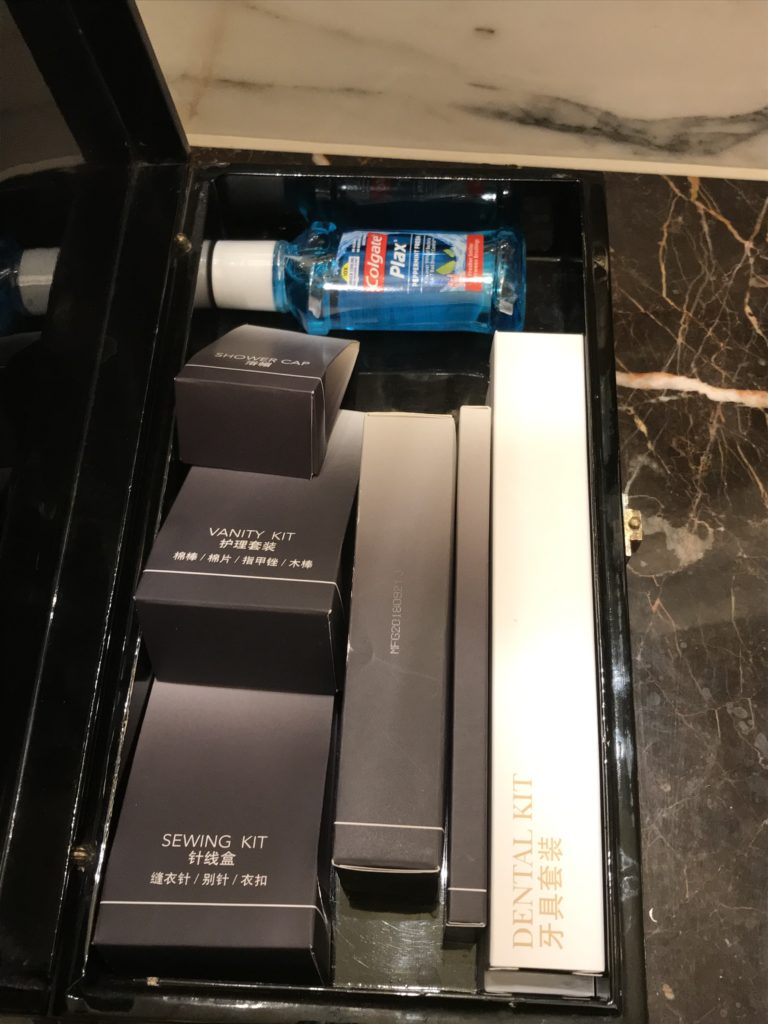 a black box with boxes and a bottle of hand sanitizer
