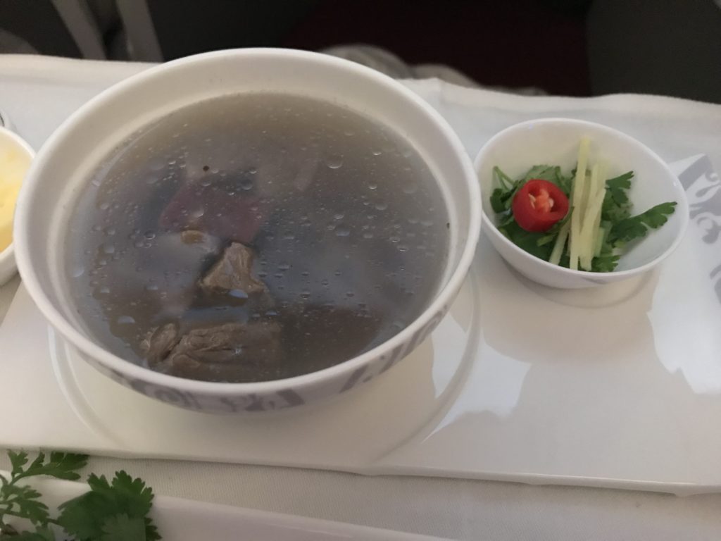 a bowl of soup and a small bowl of salad