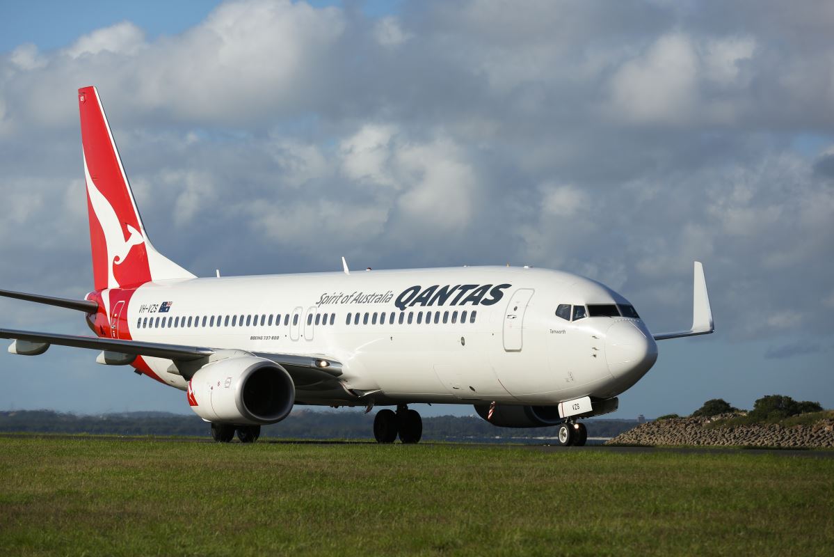 a white airplane on a runway