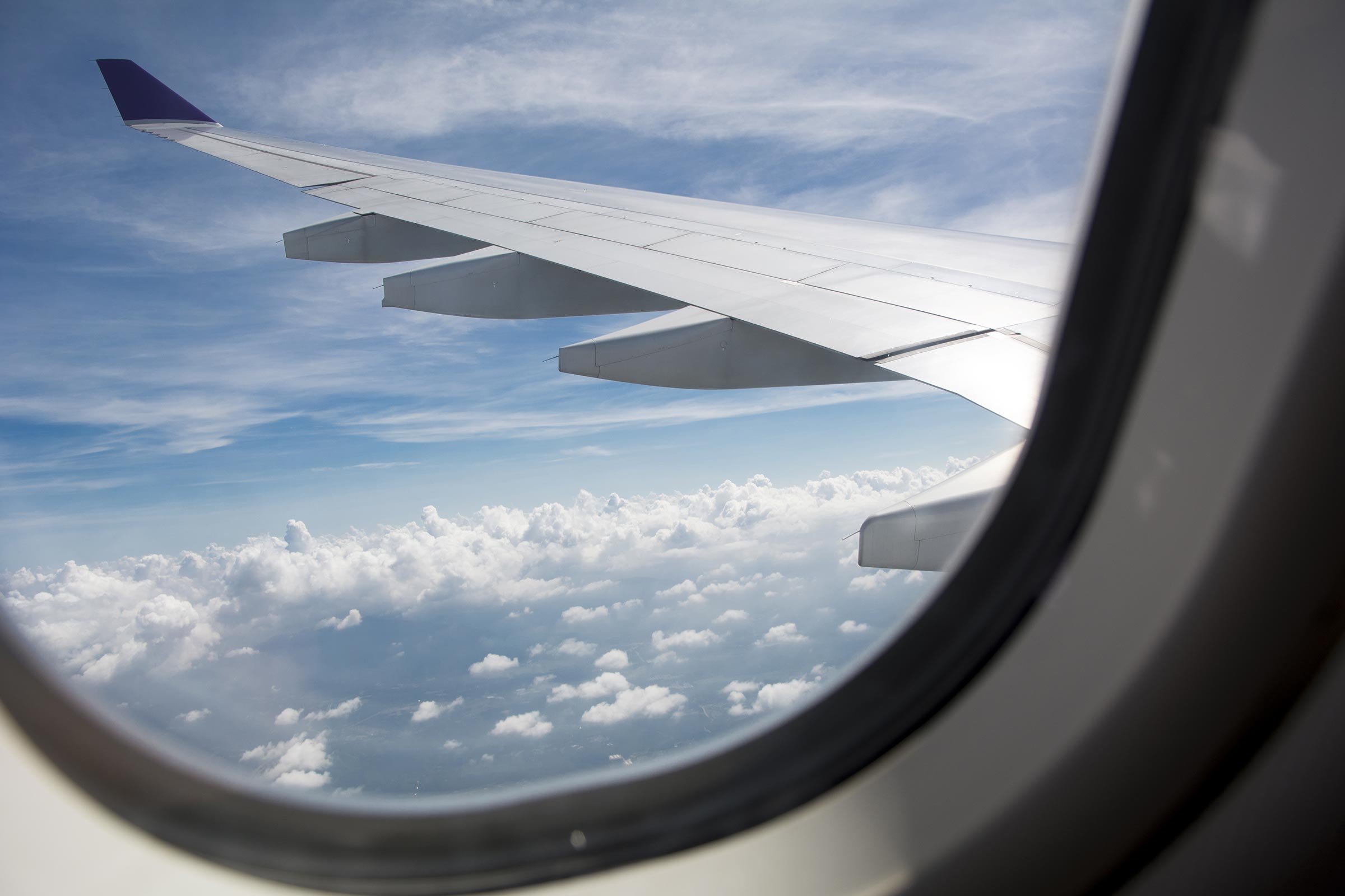 an airplane wing and clouds