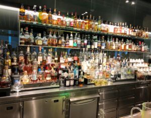 a bar with many bottles of alcohol