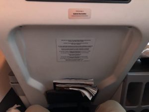 a paper in the back of an airplane