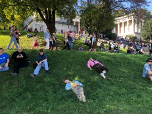 a group of people lying on grass